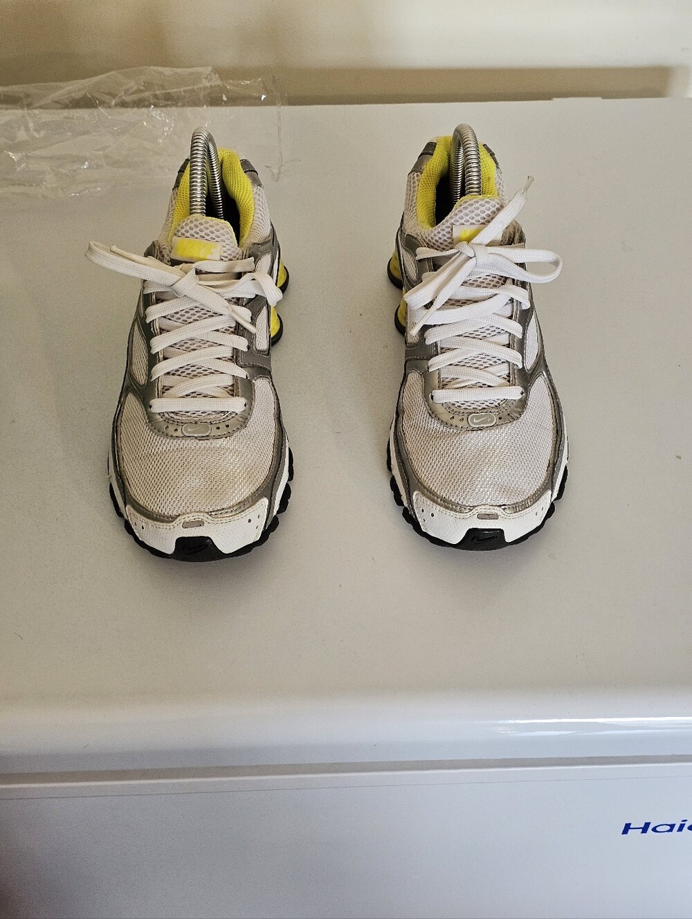 White and Gray Athletic Shox with Yellow Accents